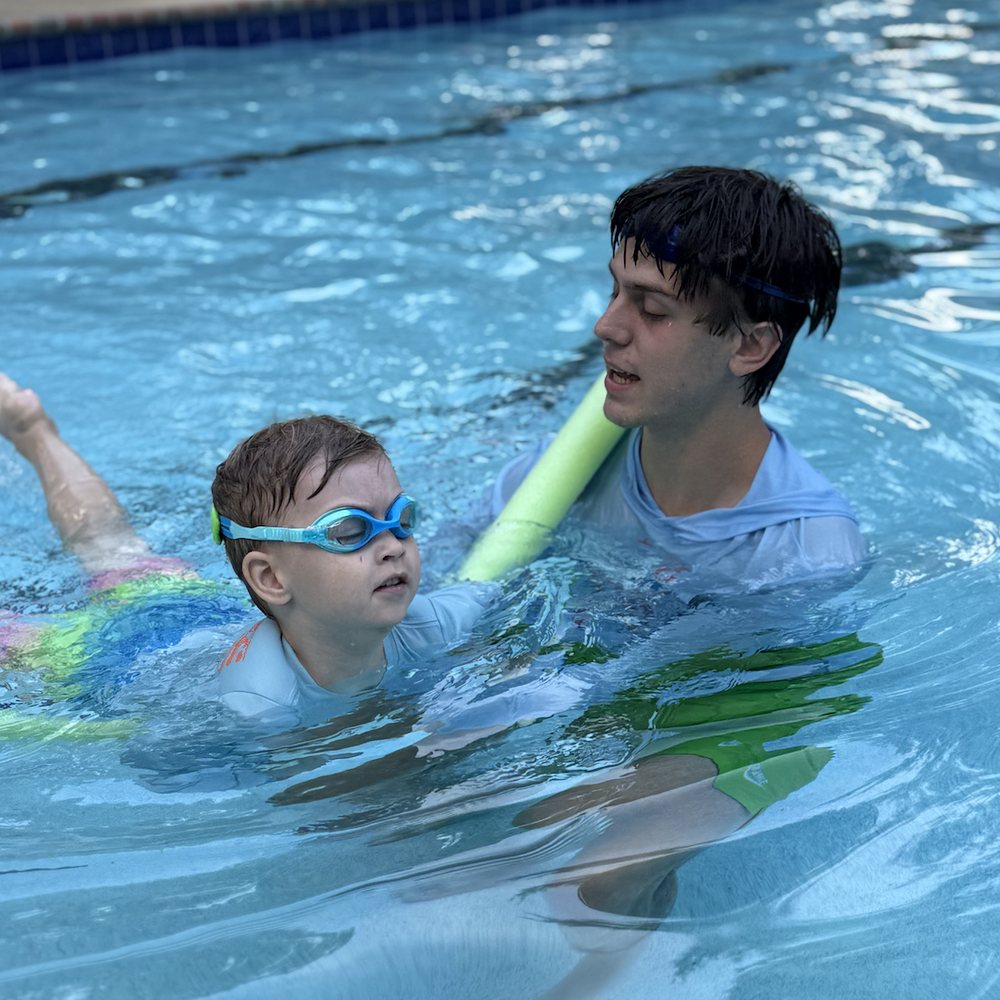A child swimming confidently